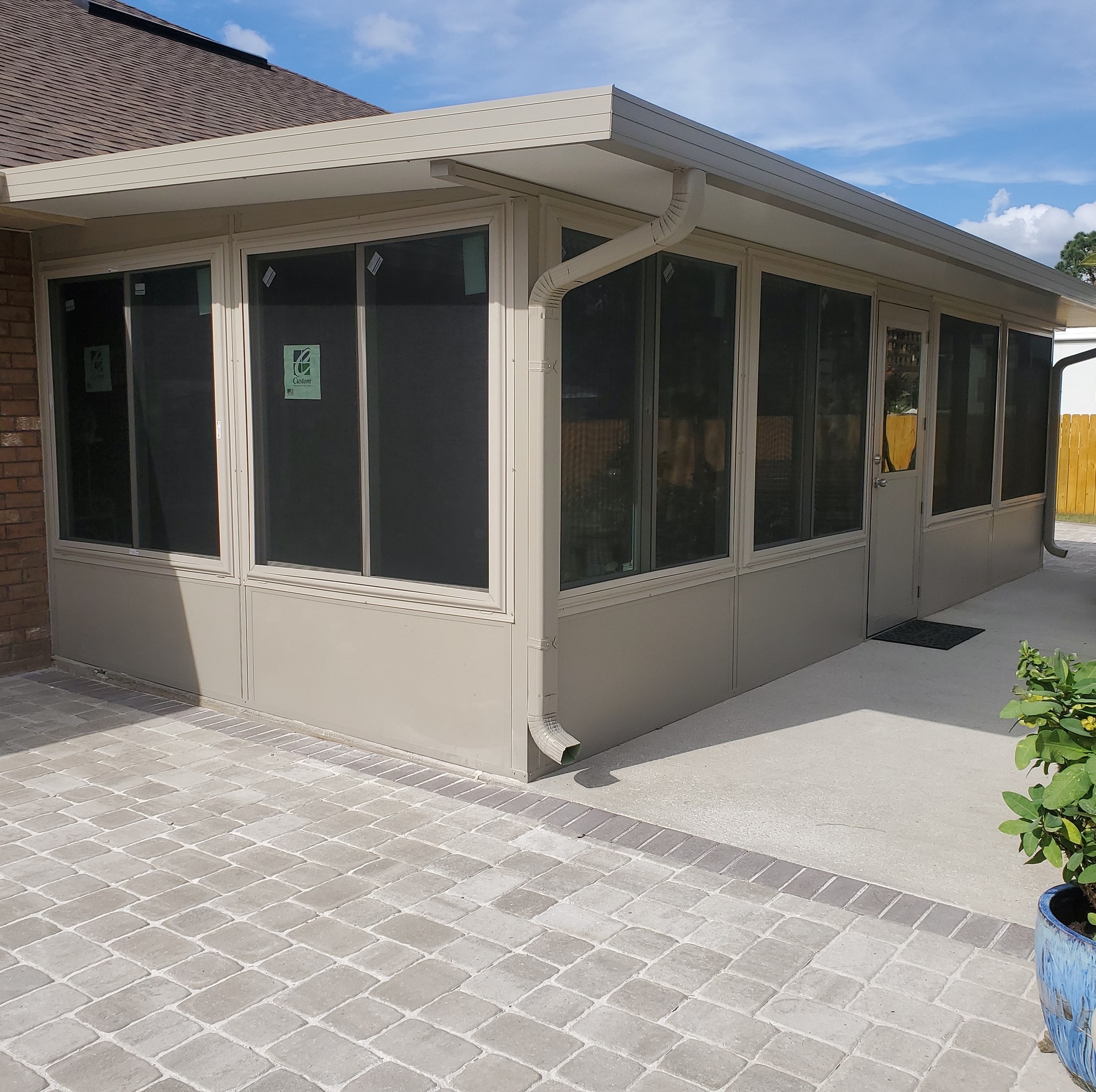 Enclosed patio and screen room addition for a Northwest Florida home