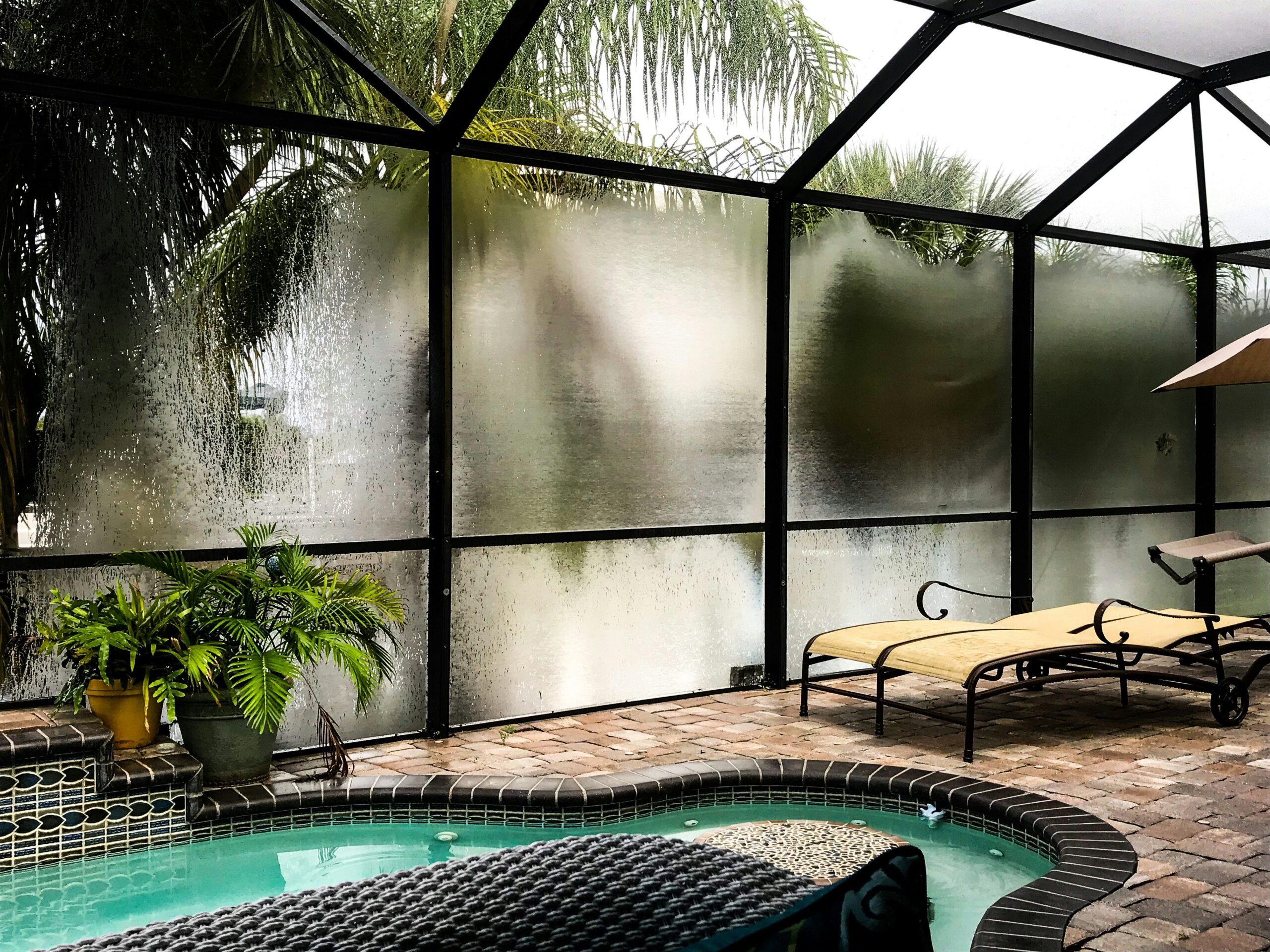 Screen enclosure repair protecting a Northwest Florida patio from rain and storm weather